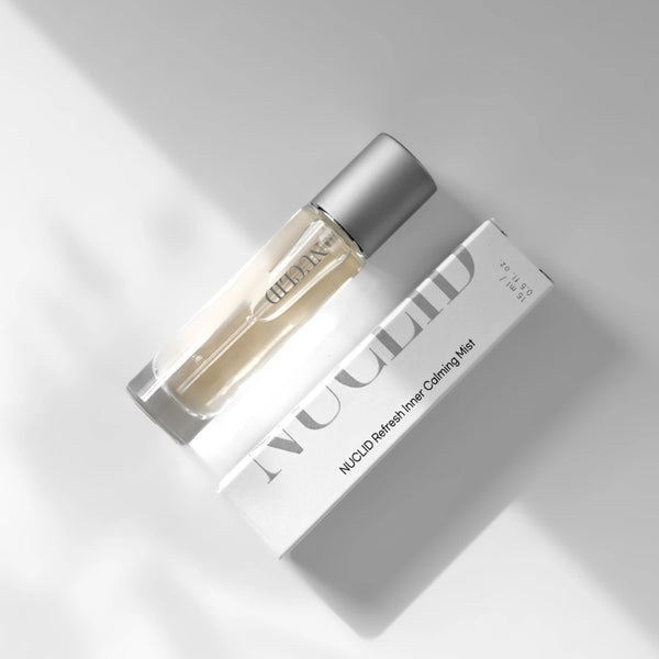 Skincare bottle and packaging on a light gray background