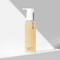 Skincare bottle with pump on a gray background