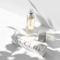 Perfume bottle and packaging on a light background