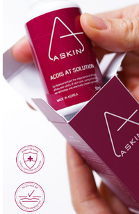 Laskin skincare product packaging held by a hand with visible brand logo.