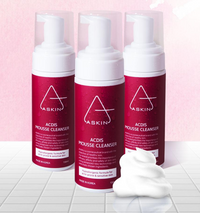 Three bottles of AASKIN ACDIS Mousse Cleanser on a white and pink background
