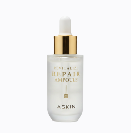Repair ampoule bottle with gold cap on a white background