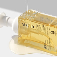NUCLID skincare product with dropper on a light gray background