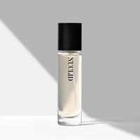 Clear bottle with black cap labeled 'NUCLID' on a gray background