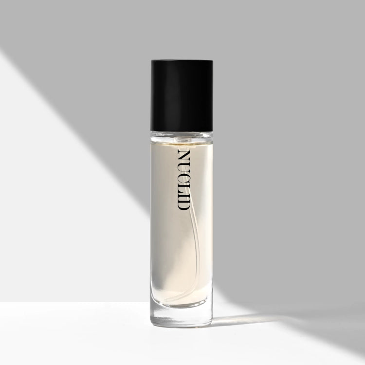 Clear bottle with black cap labeled 'NUCLID' on a gray background